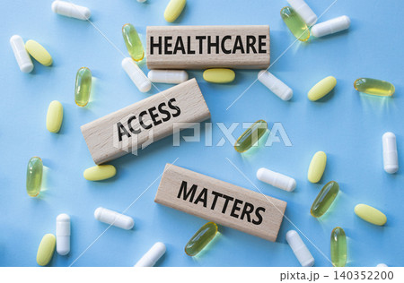 Healthcare Access Matters symbol. Concept words Healthcare Access Matters on wooden blocks. Beautiful blue background with pills. Healthcare and Healthcare Access Matters concept. Copy space. Healthcare Access Matters symbol. Concept words Healthcare Access Matters on wooden blocks. Beautiful blue background with pills. Healthcare and Healthcare Access Matters concept. Copy space. 140352200