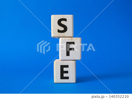 SFE - Sales Force Effectiveness. Wooden cubes with word SFE. Beautiful blue background. Business and Sales Force Effectiveness concept. Copy space. SFE - Sales Force Effectiveness. Wooden cubes with word SFE. Beautiful blue background. Business and Sales Force Effectiveness concept. Copy space. 140352210