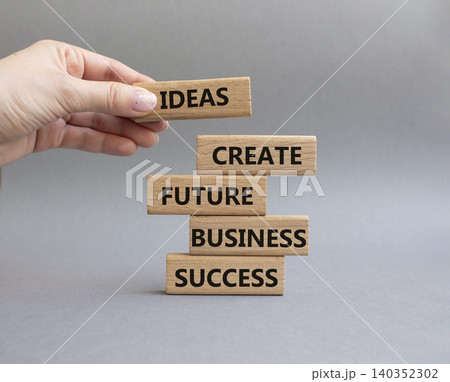Business success symbol. Wooden blocks with words Ideas create future business success. Beautiful orange background. Business and Business success concept. Copy space Business success symbol. Wooden blocks with words Ideas create future business success. Beautiful orange background. Business and Business success concept. Copy space 140352302