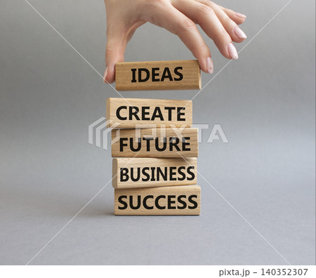 Business success symbol. Wooden blocks with words Ideas create future business success. Beautiful orange background. Business and Business success concept. Copy space 140352307