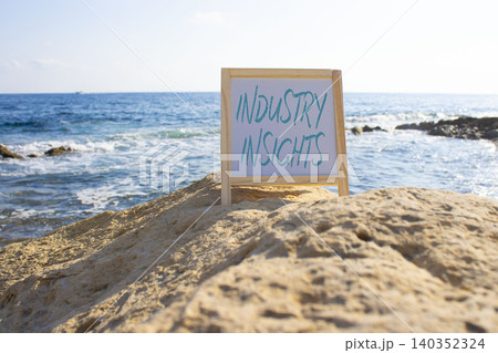 Industry Insights symbol. White blackboard with Concept words Industry Insights. Beautiful sea background. Business and Industry Insights concept. Copy space. 140352324