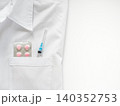White medical coat with a syringe in the pocket 140352753