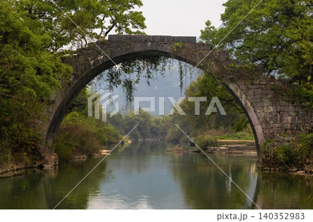Scenic view of Fuli Bridge, a historic stone arch bridge built more than 500 years ago Scenic view of Fuli Bridge, a historic stone arch bridge built more than 500 years ago 140352983