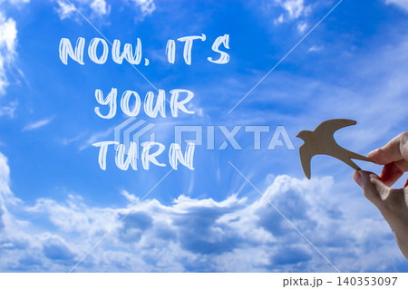Now it's your turn symbol. Concept words Now it's your turn on beautiful blue sky. Beautiful blue sky background. Businessman hand. Business Now it's your turn motivational support concept. Copy space Now it's your turn symbol. Concept words Now it's your turn on beautiful blue sky. Beautiful blue sky background. Businessman hand. Business Now it's your turn motivational support concept. Copy space 140353097