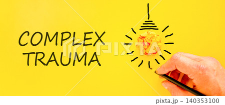 Complex trauma symbol. Concept words Complex trauma on beautiful yellow paper. Beautiful yellow background. Light bulb icon. Psychologist hand. Psychological complex trauma support concept. Copy space 140353100