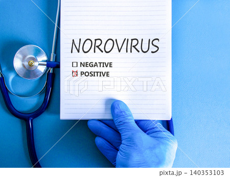 Norovirus word symbol. Concept words Norovirus positive on beautiful white note. Beautiful blue background. Doctor hand in blue medical glove. Stethoscope. Medical Norovirus concept. Copy space. Norovirus word symbol. Concept words Norovirus positive on beautiful white note. Beautiful blue background. Doctor hand in blue medical glove. Stethoscope. Medical Norovirus concept. Copy space. 140353103