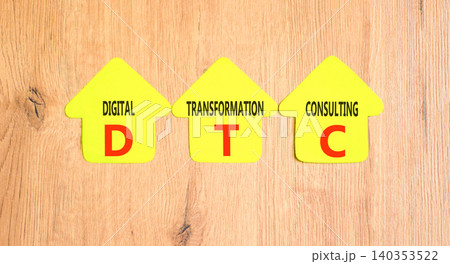 DTC digital transformation consulting symbol. Concept words DTC digital transformation consulting on beautiful yellow paper houses. Beautiful wooden background. Business DTC concept. Copy space. DTC digital transformation consulting symbol. Concept words DTC digital transformation consulting on beautiful yellow paper houses. Beautiful wooden background. Business DTC concept. Copy space. 140353522