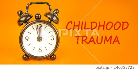 Childhood trauma words symbol. Concept words Childhood trauma on beautiful white paper. Beautiful orange background. Black alarm clock. Psychological childhood trauma support concept. Copy space. Childhood trauma words symbol. Concept words Childhood trauma on beautiful white paper. Beautiful orange background. Black alarm clock. Psychological childhood trauma support concept. Copy space. 140353725