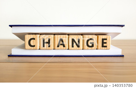 Change symbol. Concept word Change on beautiful wooden blocks in beautiful book. Beautiful wooden table white background. Business change concept. Copy space. 140353780