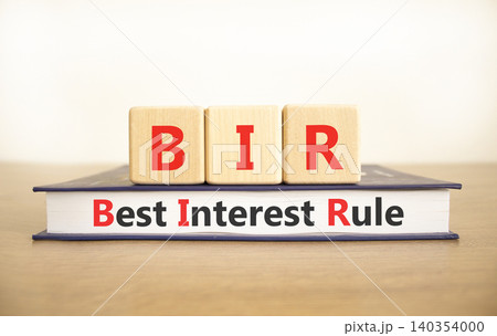 BIR best interest rule symbol. Concept words BIR best interest rule on beautiful wooden blocks and book. Beautiful white background. Business BIR best interest rule concept. Copy space. 140354000