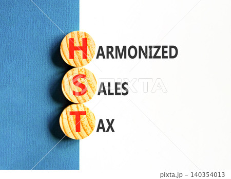 HST harmonized sales tax symbol. Concept words HST harmonized sales tax on beautiful wooden circles. Beautiful white blue background. Business HST harmonized sales tax concept. Copy space HST harmonized sales tax symbol. Concept words HST harmonized sales tax on beautiful wooden circles. Beautiful white blue background. Business HST harmonized sales tax concept. Copy space 140354013