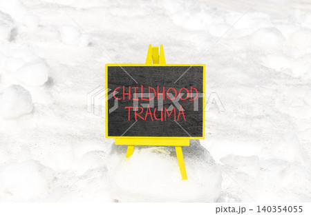 Childhood trauma words symbol. Concept words Childhood trauma on beautiful black blackboard. Beautiful white snow background. Psychological childhood trauma support concept. Copy space. Childhood trauma words symbol. Concept words Childhood trauma on beautiful black blackboard. Beautiful white snow background. Psychological childhood trauma support concept. Copy space. 140354055