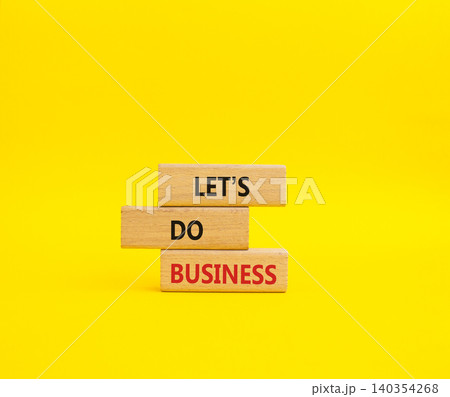 Lets do business symbol. Concept word Lets do business on wooden blocks. Beautiful yellow background. Business and Lets do business concept. Copy space Lets do business symbol. Concept word Lets do business on wooden blocks. Beautiful yellow background. Business and Lets do business concept. Copy space 140354268