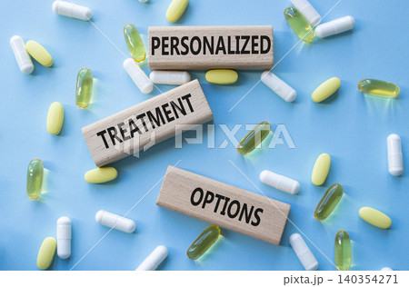 Personalized treatment options symbol. Concept words Personalized treatment options on wooden blocks. Beautiful blue background with pills. Healthcare and Personalized treatment options concept. Copy Personalized treatment options symbol. Concept words Personalized treatment options on wooden blocks. Beautiful blue background with pills. Healthcare and Personalized treatment options concept. Copy 140354271