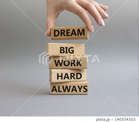 DREAM BIG WORK HARD symbol. Wooden blocks with words DREAM BIG WORK HARD ALWAYS. Businessman hand. Beautiful grey background. Businessman hand. Business and DREAM BIG WORK HARD concept. Copy space DREAM BIG WORK HARD symbol. Wooden blocks with words DREAM BIG WORK HARD ALWAYS. Businessman hand. Beautiful grey background. Businessman hand. Business and DREAM BIG WORK HARD concept. Copy space 140354303