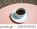 Cup of coffee on pink table 140354501