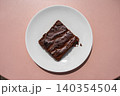 Chocolate brownie on pink table 140354504