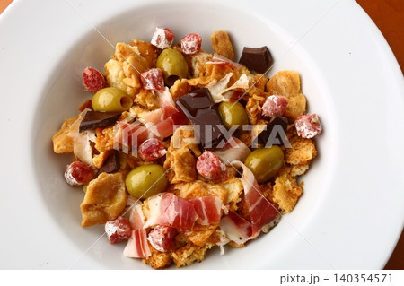 Breadsticks with Ham and CTraditional Migas with Cured Meats Olives and Chocolateured Pork Snack Breadsticks with Ham and CTraditional Migas with Cured Meats Olives and Chocolateured Pork Snack 140354571