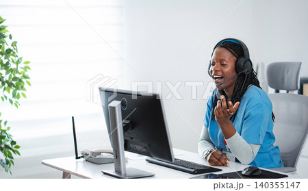 Nurse in headset providing telehealth medical advice online Nurse in headset providing telehealth medical advice online 140355147