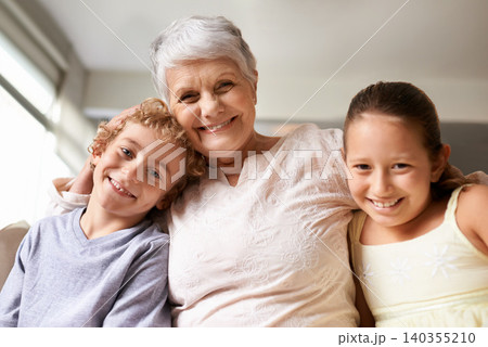 Portrait, hug and home with granny, grandchildren and bonding together with love and weekend break. Face, family and old women with kids and embrace with fun and playful with vacation and cheerful 140355210