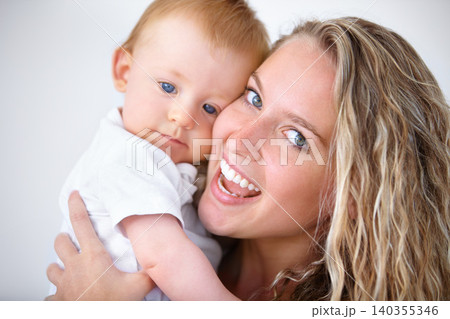 Happy mother, portrait and hug with baby for love in care, trust or bonding together on holiday at home. Face of mom or little toddler with smile for family, childhood or motherhood in relax at house 140355346