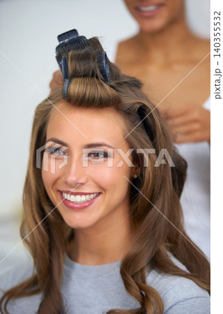 Face, smile and hair curlers with woman in salon for professional shampoo or keratin treatment. Beauty, makeup and haircare with happy young model backstage or behind the scenes for cosmetic makeover Face, smile and hair curlers with woman in salon for professional shampoo or keratin treatment. Beauty, makeup and haircare with happy young model backstage or behind the scenes for cosmetic makeover 140355532