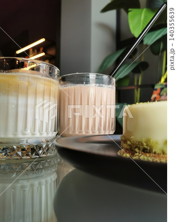 Two glass cups with coffee drink, ice latte with milk foam. Summer drink Two glass cups with coffee drink, ice latte with milk foam. Summer drink 140355639
