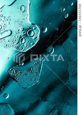 Macro view of clear bubbles in turquoise liquid stream Macro view of clear bubbles in turquoise liquid stream 140355708