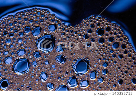 Close up of oil and water mixture creating bubbles texture Close up of oil and water mixture creating bubbles texture 140355713