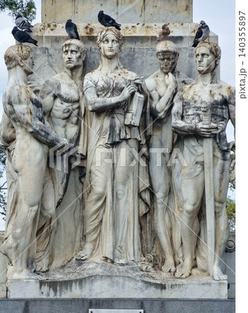 Cordoba, Argentina - April 11, 2026: Sculptural group at the base of the Dante Monument Cordoba, Argentina - April 11, 2026: Sculptural group at the base of the Dante Monument 140355897