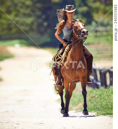 Happy woman, countryside and cowgirl with horse for ride, journey or outdoor adventure in nature. Female person or western rider with hat, saddle and animal stallion or riding pet at ranch or farm Happy woman, countryside and cowgirl with horse for ride, journey or outdoor adventure in nature. Female person or western rider with hat, saddle and animal stallion or riding pet at ranch or farm 140355985