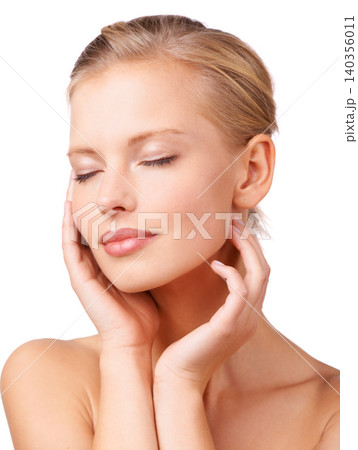 Calm woman, makeup and relax with facial treatment for beauty, cosmetics or skincare on a white studio background. Face of young female person or model in satisfaction for soft skin or wellness Calm woman, makeup and relax with facial treatment for beauty, cosmetics or skincare on a white studio background. Face of young female person or model in satisfaction for soft skin or wellness 140356011