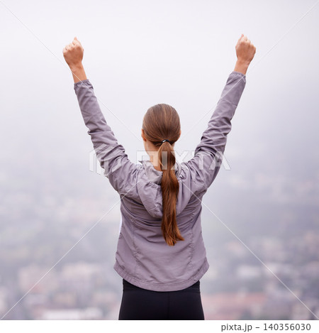 Fitness, success and victory with woman in mountains for celebration of running goal or target. Exercise, achievement and cheering with back of athlete hands raised in nature for cardio workout 140356030