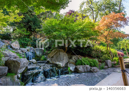 Scenic landscape view of Kyoto Garden in Holland Park, West London, during a sunny spring day. Scenic landscape view of Kyoto Garden in Holland Park, West London, during a sunny spring day. 140356083
