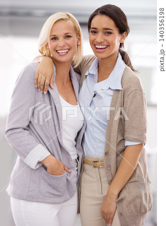 Portrait, coworker and woman in office with hug in happiness, collaboration and teamwork with positivity. Closeup, work and employee in smile with friendly, professional and together for support. Portrait, coworker and woman in office with hug in happiness, collaboration and teamwork with positivity. Closeup, work and employee in smile with friendly, professional and together for support. 140356198