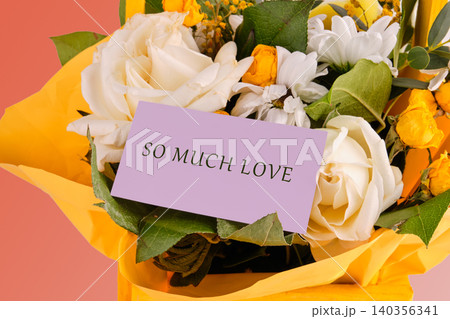 A vibrant bouquet showcases delicate roses and cheerful blooms, beautifully wrapped with a heartfelt card that reads so much love, perfect for celebration or affection A vibrant bouquet showcases delicate roses and cheerful blooms, beautifully wrapped with a heartfelt card that reads so much love, perfect for celebration or affection 140356341