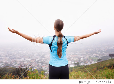 Fitness, freedom and sports with runner woman outdoor in mountains for cardio training or workout. Exercise, nature and view with athlete running in foggy morning for health or wellness from back Fitness, freedom and sports with runner woman outdoor in mountains for cardio training or workout. Exercise, nature and view with athlete running in foggy morning for health or wellness from back 140356413