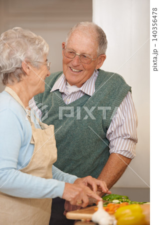 Senior couple, cutting vegetables and laughing in kitchen, food preparation and love at home. Elderly people, healthy meal and organic ingredients for nutrition, funny conversation and retirement Senior couple, cutting vegetables and laughing in kitchen, food preparation and love at home. Elderly people, healthy meal and organic ingredients for nutrition, funny conversation and retirement 140356478