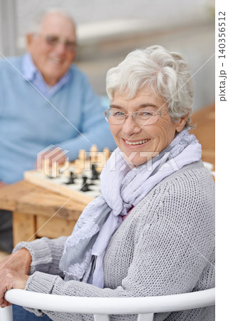 Chess, game and happy portrait with old people together in retirement to relax with happiness. Elderly, man and woman outdoor with a smile for winning competition, checkmate or activity with strategy Chess, game and happy portrait with old people together in retirement to relax with happiness. Elderly, man and woman outdoor with a smile for winning competition, checkmate or activity with strategy 140356512