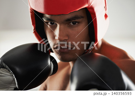 Fitness, cardio and man boxer in gym for exercise, workout and combat training for competition. Breathing, health and shirtless male athlete fighter in boxing ring with gloves in sports center. Fitness, cardio and man boxer in gym for exercise, workout and combat training for competition. Breathing, health and shirtless male athlete fighter in boxing ring with gloves in sports center. 140356593
