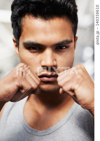 Man, portrait and boxing with confidence, closeup and fists ready to punch in match for training and exercise. Male person, workout and focus in gym, mma and boxer for sports and combat for defence Man, portrait and boxing with confidence, closeup and fists ready to punch in match for training and exercise. Male person, workout and focus in gym, mma and boxer for sports and combat for defence 140356610