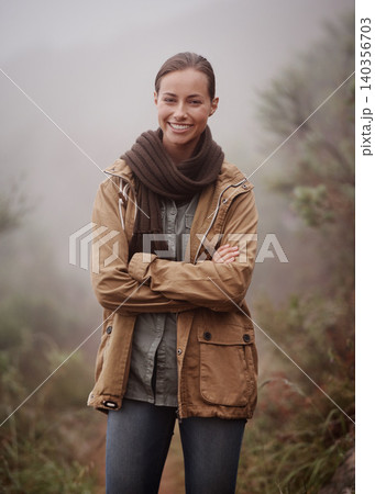 Hiking, portrait and happy woman with arms crossed in nature for travel, wellness or walk outdoor in winter. Face, pride hiker in a forest for fresh air, camping or adventure, journey or campsite fun Hiking, portrait and happy woman with arms crossed in nature for travel, wellness or walk outdoor in winter. Face, pride hiker in a forest for fresh air, camping or adventure, journey or campsite fun 140356703