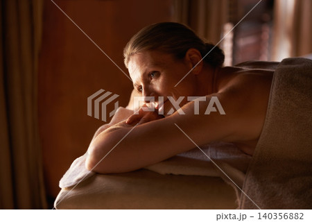 Woman, happy and lying for wellness, spa and tranquil getaway at luxury retreat in Amsterdam. Smile, calm and mature female person contemplating on massage table for peaceful, treatment and self care Woman, happy and lying for wellness, spa and tranquil getaway at luxury retreat in Amsterdam. Smile, calm and mature female person contemplating on massage table for peaceful, treatment and self care 140356882