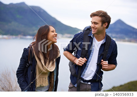 Hiking, nature and couple on mountain laugh with backpack for love, trekking and explore landscape. Travel, dating and happy man and woman by scenic view on holiday, vacation and outdoor adventure 140356933