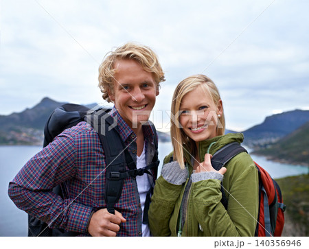 Happy couple, portrait and hiking with backpack on mountain for sightseeing, travel or outdoor journey in nature. Face of young man, woman or hikers carrying bag for trekking, fitness or adventure Happy couple, portrait and hiking with backpack on mountain for sightseeing, travel or outdoor journey in nature. Face of young man, woman or hikers carrying bag for trekking, fitness or adventure 140356946