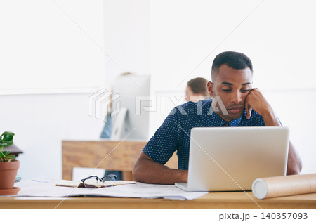 African, businessman and laptop with office, bored and tired with work. Architect, technology and paperwork with computer, fatigue and startup or small business with plans for entrepreneurship 140357093
