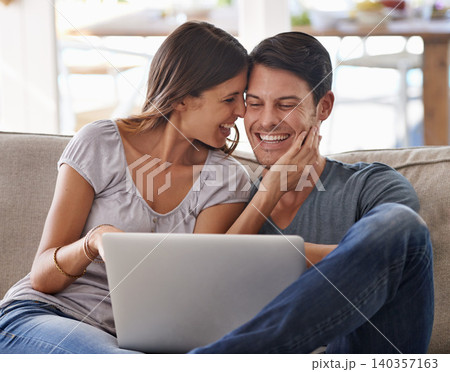Happy couple, laptop and love on sofa with good news, support or care in living room at home. Excited man or woman with smile on computer together for online browsing, alert or notification at house Happy couple, laptop and love on sofa with good news, support or care in living room at home. Excited man or woman with smile on computer together for online browsing, alert or notification at house 140357163