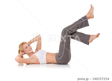 Woman, portrait or pilates and stretching in studio for exercise, healthy body or wellness with fitness or smile. Yoga, person and face or flexible in sportswear for core strength on white background 140357254