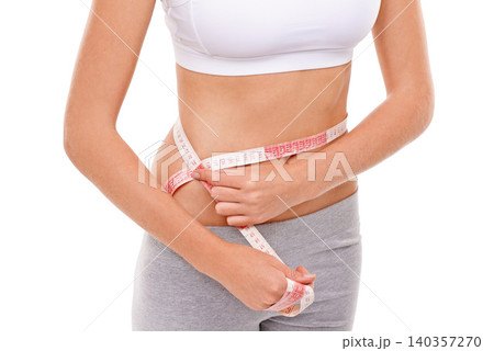 Woman, stomach and measure in studio for health, fitness and track for weight loss. Female person, results on progress and nutrition for slim body, abdomen and workout isolated with white background Woman, stomach and measure in studio for health, fitness and track for weight loss. Female person, results on progress and nutrition for slim body, abdomen and workout isolated with white background 140357270