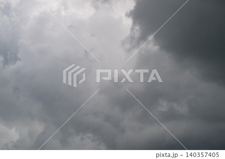 Menacing cloud formations gather quickly. Foreboding atmospheric conditions suggest heavy rainfall. Intense storm clouds rolling in create striking visual for film and ads Menacing cloud formations gather quickly. Foreboding atmospheric conditions suggest heavy rainfall. Intense storm clouds rolling in create striking visual for film and ads 140357405